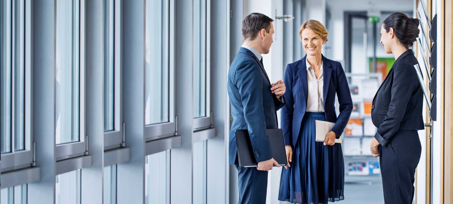 A corporate trust services team meeting in a well-lit office building